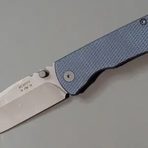 Close-up of a folding knife with a blue textured handle.