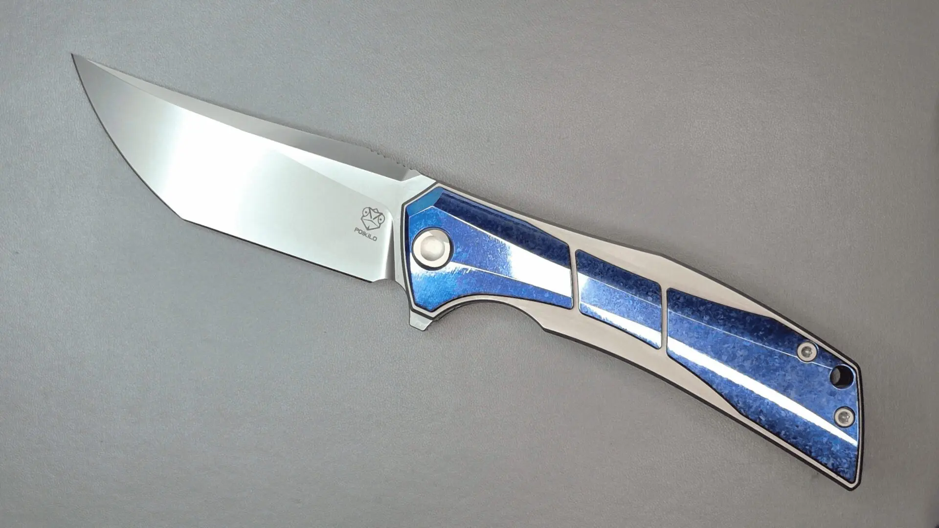 A sleek folding knife with a blue and silver handle.