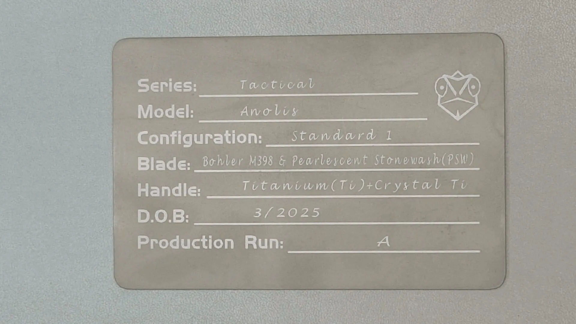 Close-up of a knife handle with detailed specifications engraved.