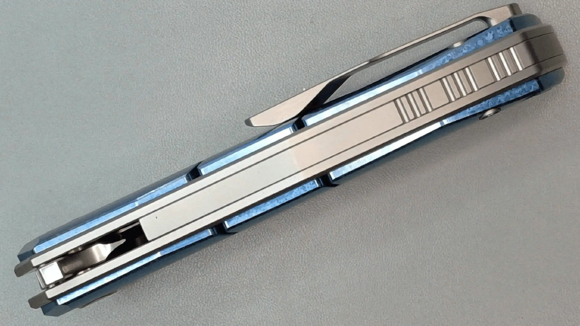 Sleek silver and black utility knife with a retractable blade.