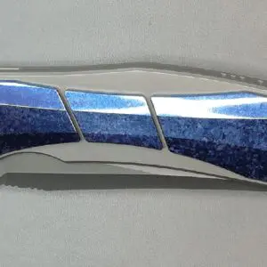 Close-up of a metallic and blue folding knife blade.