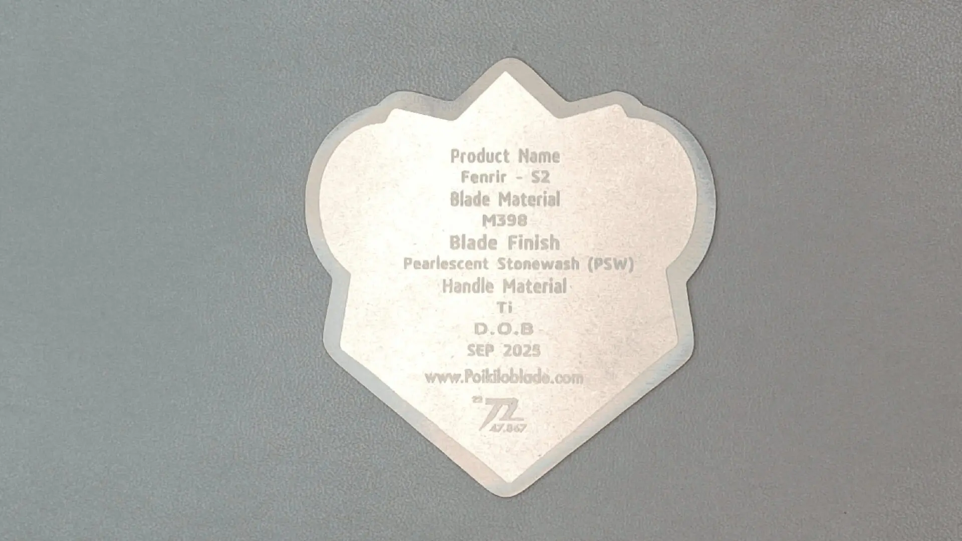 A metal blade with engraved product information and specifications.