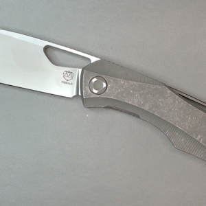A small folding pocket knife with a partially open blade.