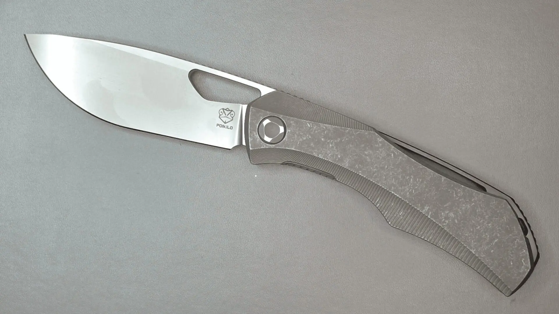 A small folding pocket knife with a partially open blade.