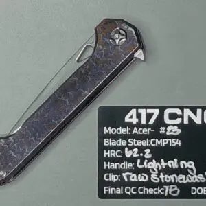 A dark steel CNC-machined blade with detailed specifications.