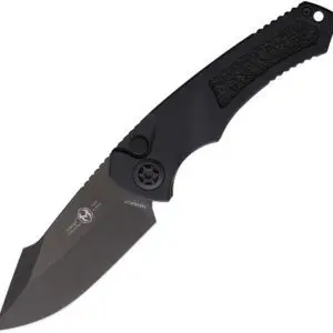 Black folding knife with textured handle and partially serrated blade.