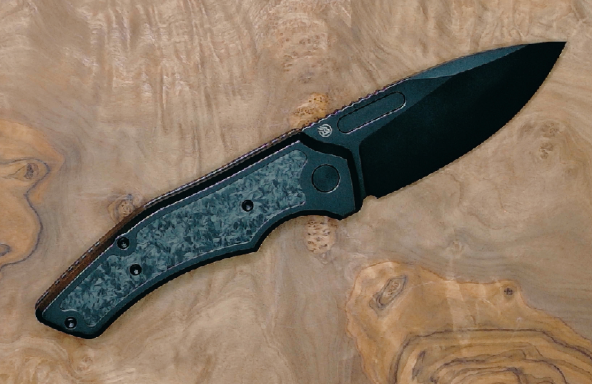 Griffin Company Scout F3.5 in hand — scale reference for full-size titanium folder