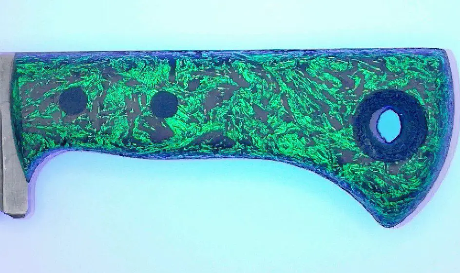 Dark Matter carbon glow handle charging under UV light, Fire Creek Forge Wharncliffe