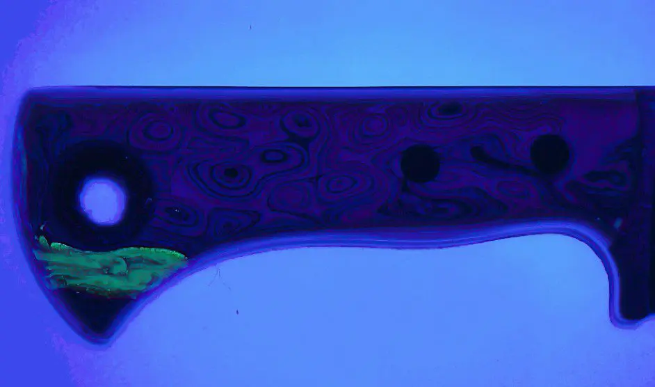 Fordite resin handle glowing under UV light, back side, Fire Creek Forge Wharncliffe