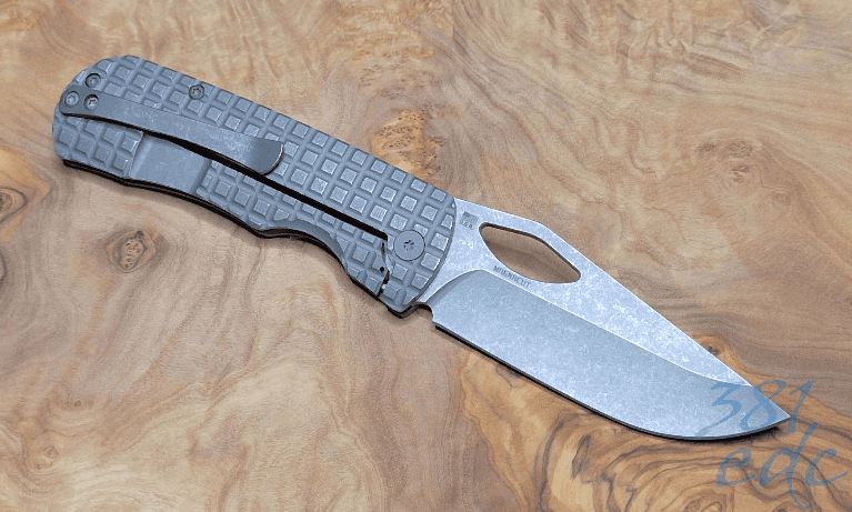 McNees Little Dixon open showing pocket clip and Frag milled titanium handle