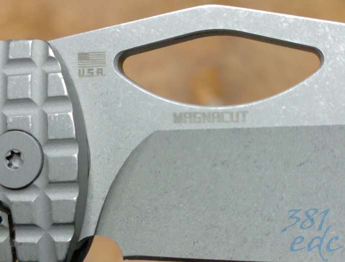 Close-up of MagnaCut blade etch on McNees Little Dixon framelock knife