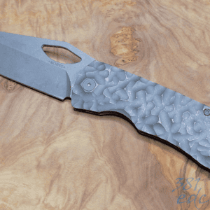 McNees Little Dixon Atomic Stonewash Rock titanium knife with MagnaCut blade open