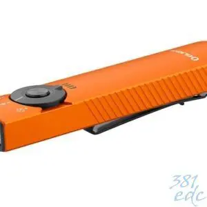 Olight Arkfeld Pro orange EDC flashlight angled view showing selector dial, pocket clip, and dual emitter head