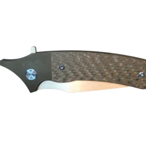 Close-up of a textured folding knife handle with a carbon fiber pattern.