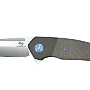 Close-up of a folding knife with a carbon fiber handle.