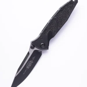 Black folding knife with a textured handle and partially serrated blade.