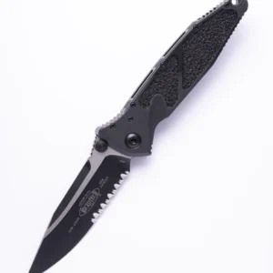 Black tactical folding knife with serrated edge and textured handle.