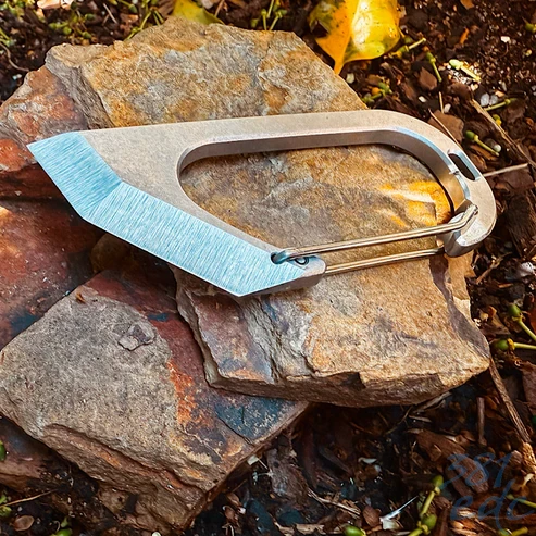 BeySeven Cutty Cutter Tool resting on stone outdoors