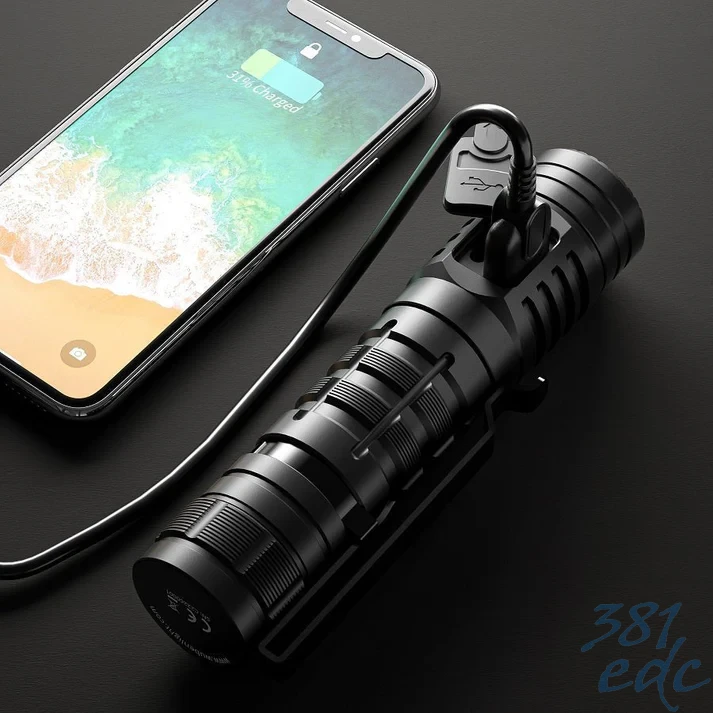 Wuben C2 flashlight charging a smartphone via built-in USB-A power bank output