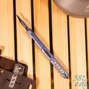 Wuben E62 multifunctional penlight in blue with No. 11 surgical blade deployed, showing full body and pocket clip